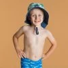 Chapeau Anti UV Bébé Réversible Bleu Et Imprimé Palmiers -Meilleur Surf Magasin chapeau anti uv bebe reversible bleu et imprime palmiers